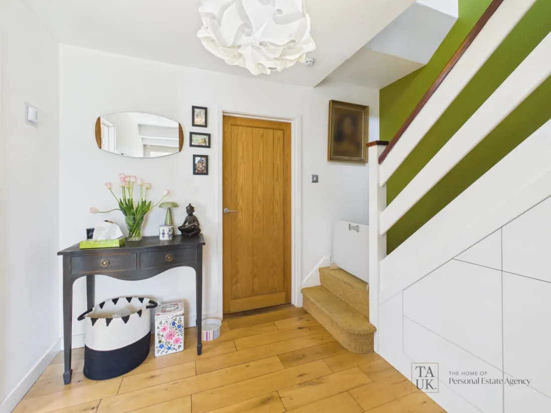 The oak-floored hallway and staircase