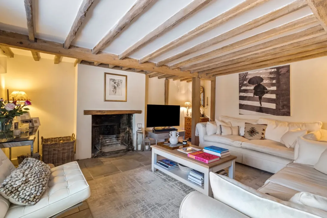 Sitting room with open fire and beam ceiling