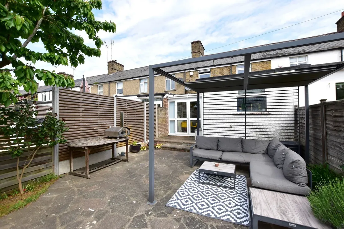 Rear patio at 48 Dickinson Square — outdoor seating outside the extended kitchen