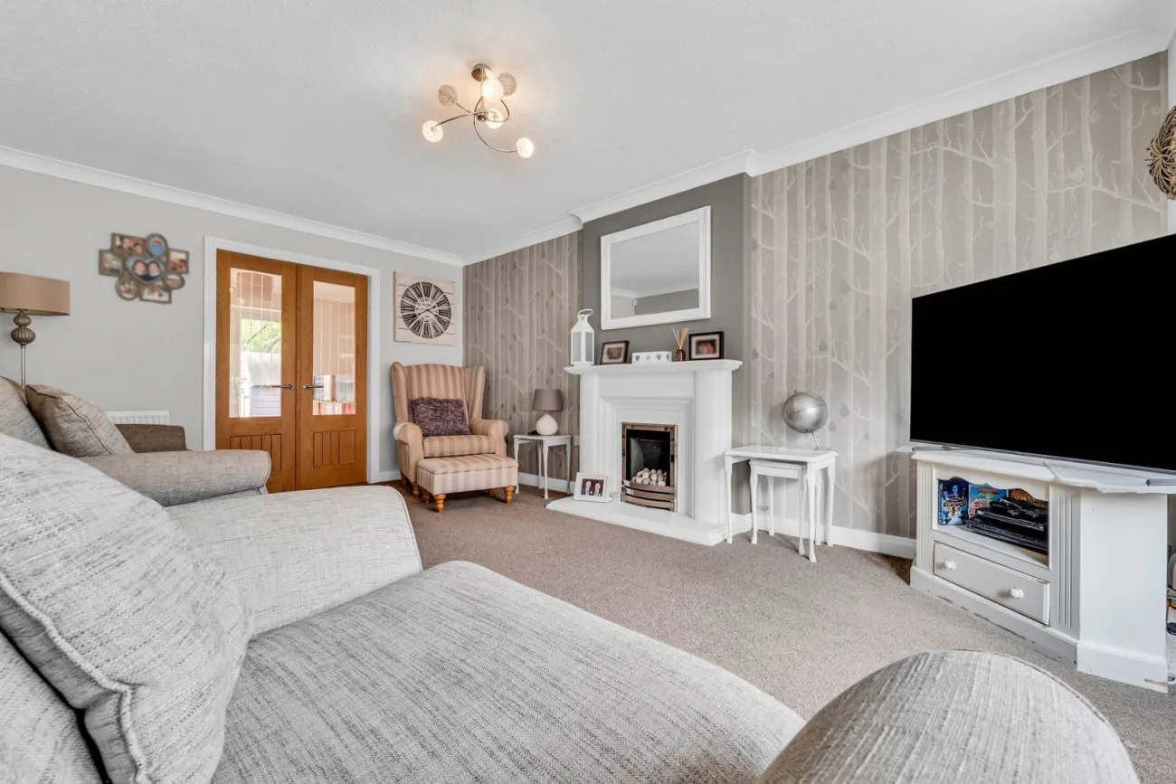 The formal lounge with bay window and fireplace