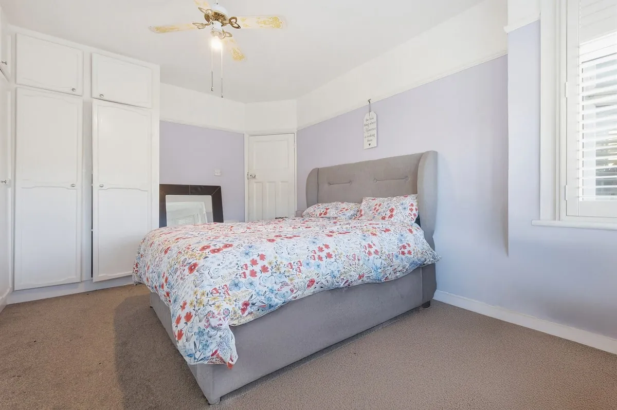 Third bedroom — full-wall fitted wardrobes