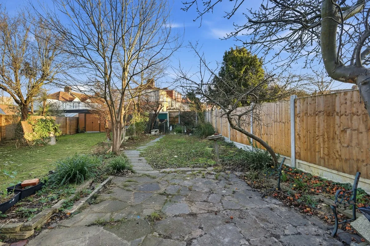 Mature rear garden — looking back toward the home