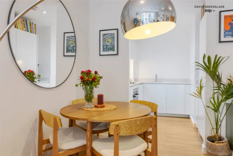 The dining area within the open-plan room