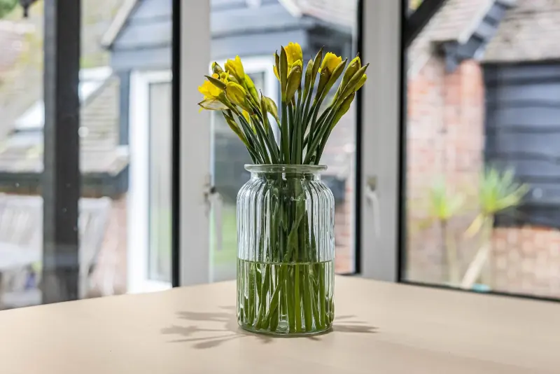 A vase of flowers on the dining table — the everyday detail