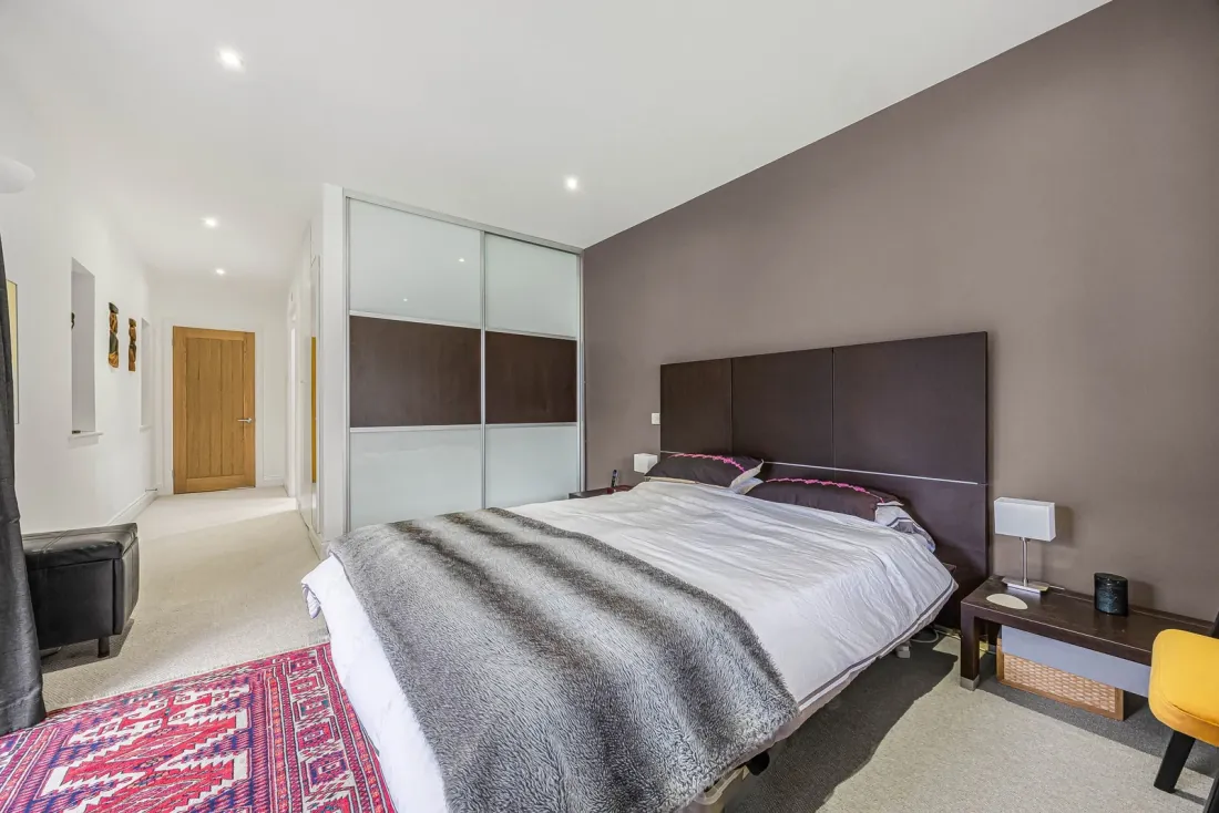 The principal bedroom — generous and quietly characterful
