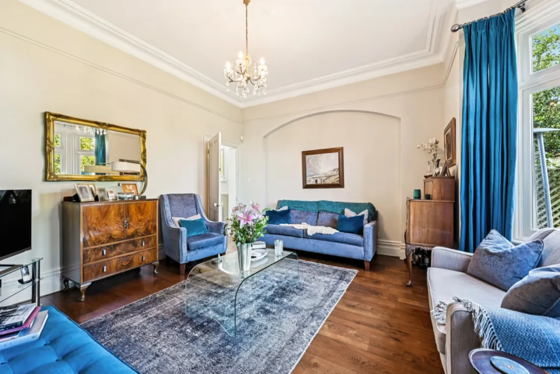 The principal drawing room with armchairs and bay window