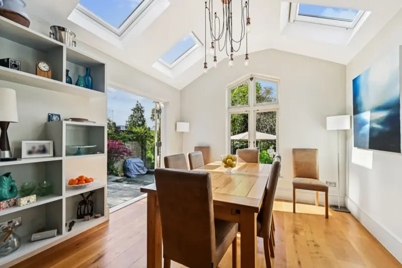The dining table beneath a roof lantern