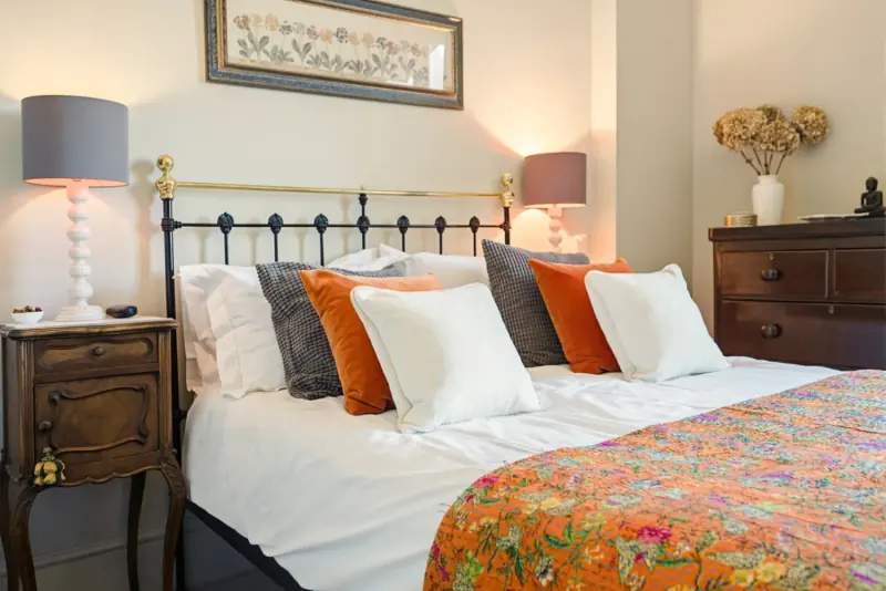 A second bedroom with crisp white linens