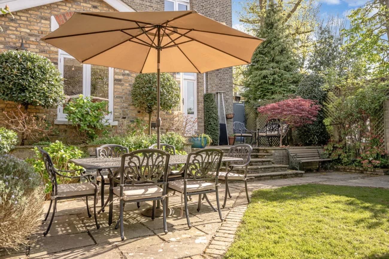 The walled, sun-drenched rear garden at Ingleby Lodge