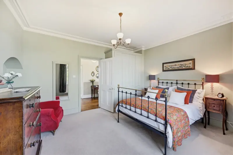A further bedroom with brass bedstead