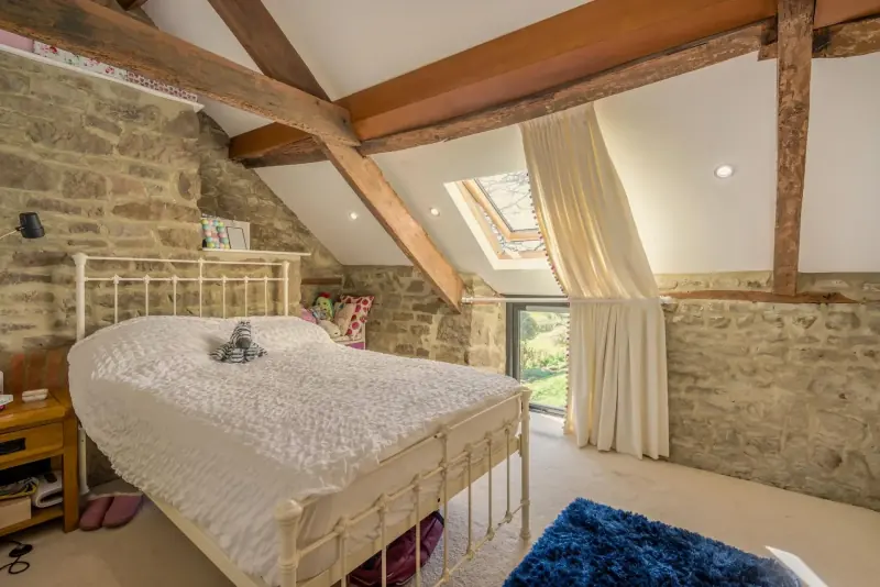 Bedroom under the vaulted long-house ceiling