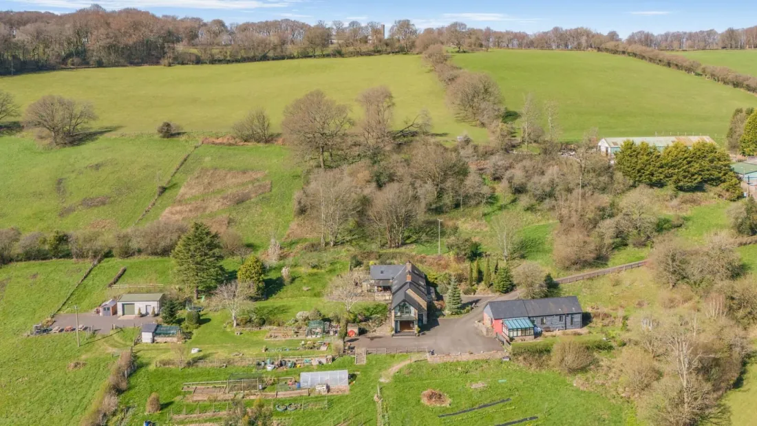 Drone view back toward the house