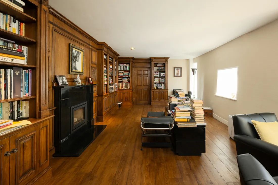 Panelled library fireplace