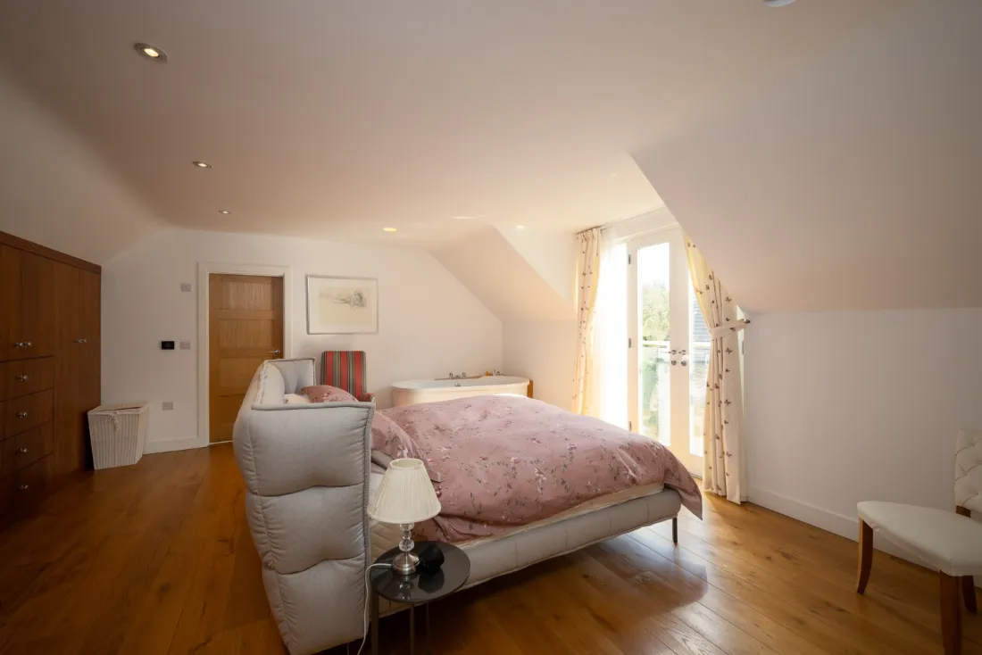 Pale bedroom with window seat