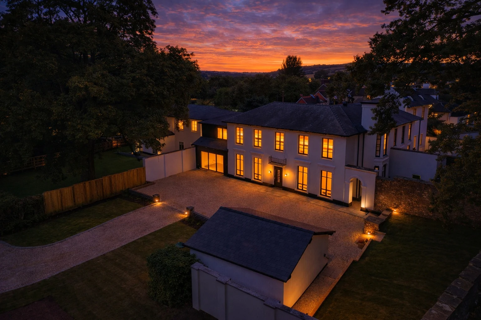 Lucia Court seen from the air above its level grounds at dusk