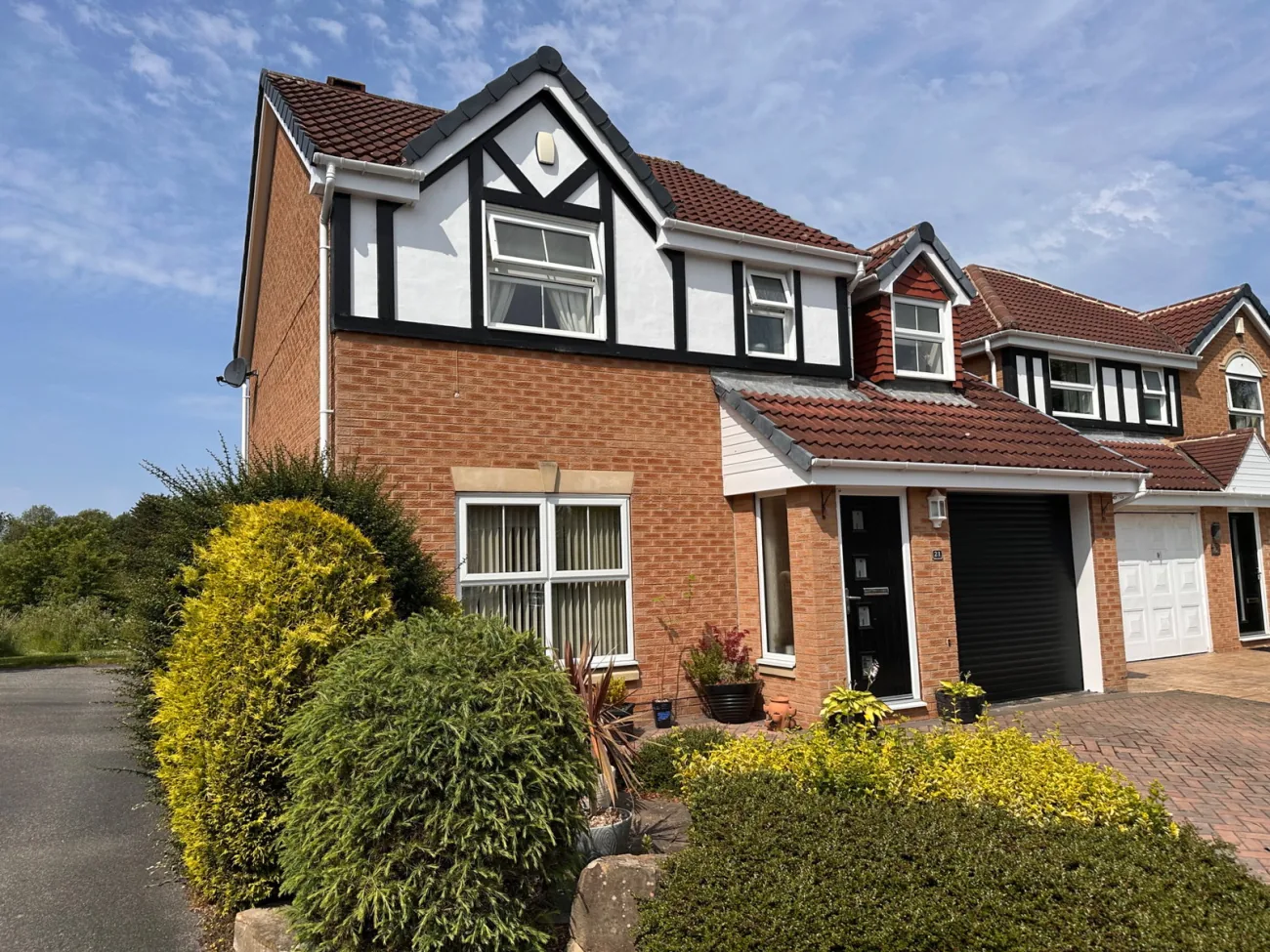 Front elevation with trees