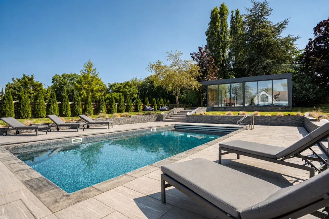 The pool and outdoor kitchen at golden hour