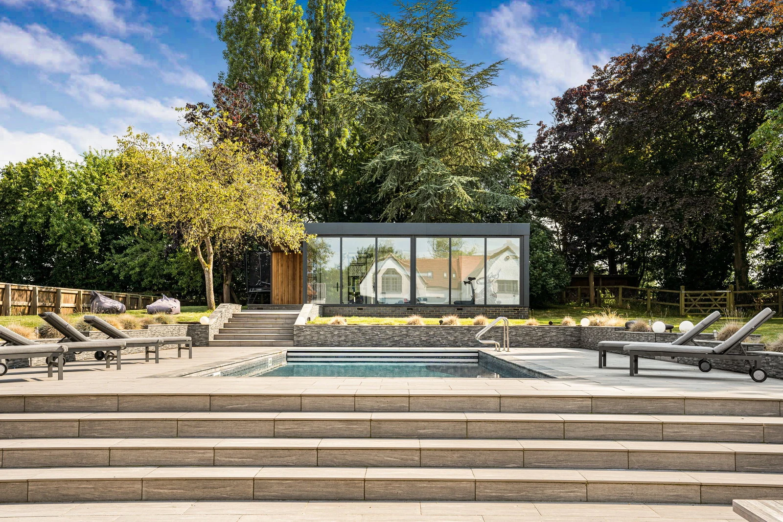 The glass-walled summerhouse and pool at Sparrows Farm