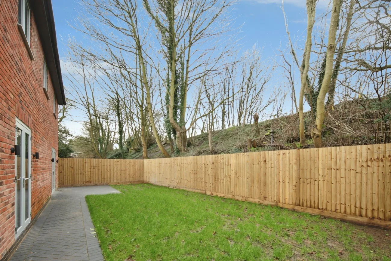 Private rear garden, lawn and patio, screened from neighbours.