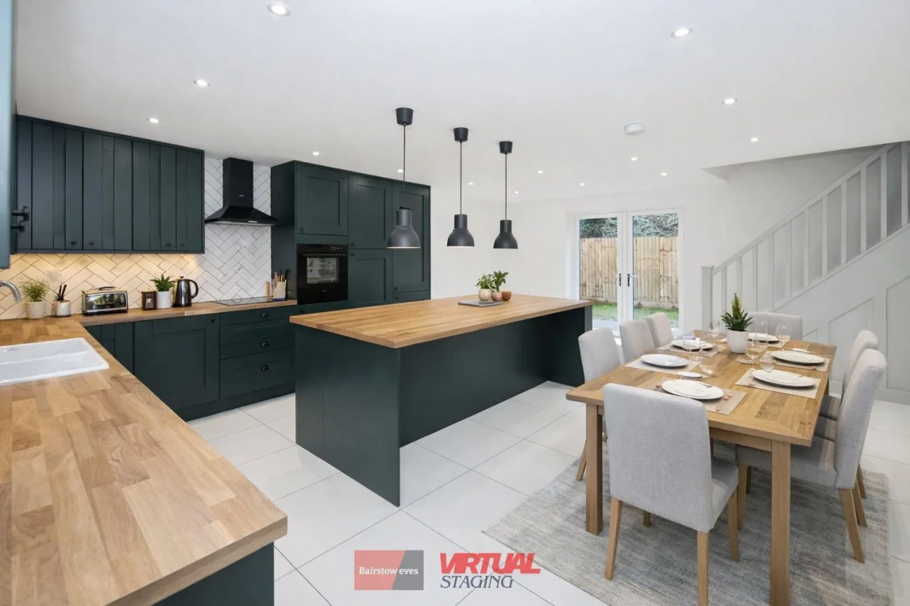 Kitchen-diner with the central island under three pendants.
