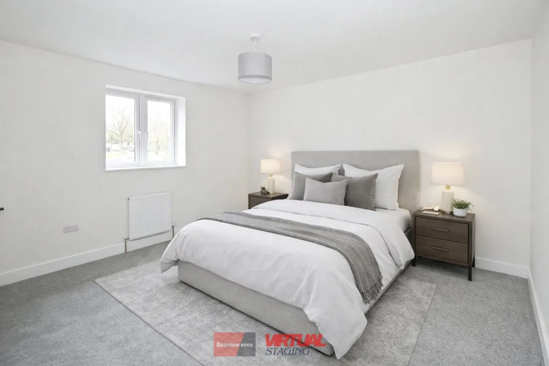 Bedroom Two dressed with double bed.