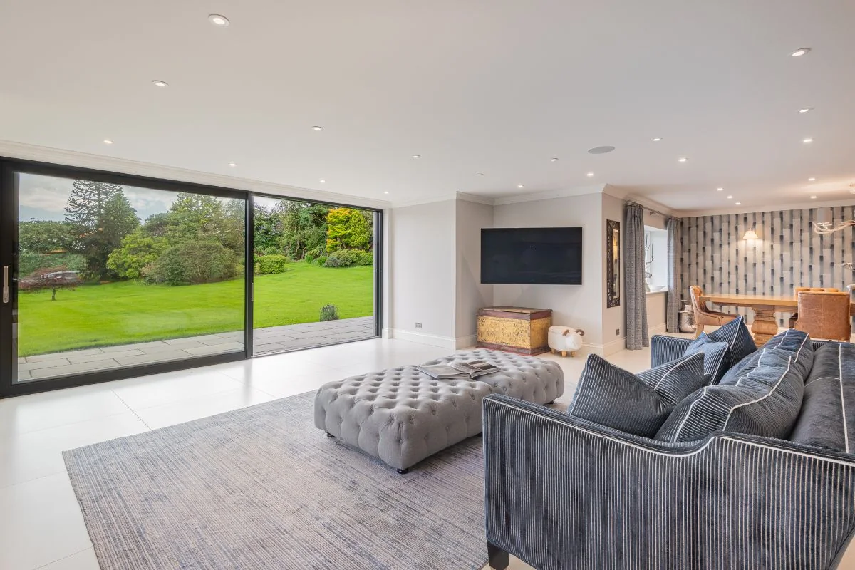 The living room with full-height sliding doors