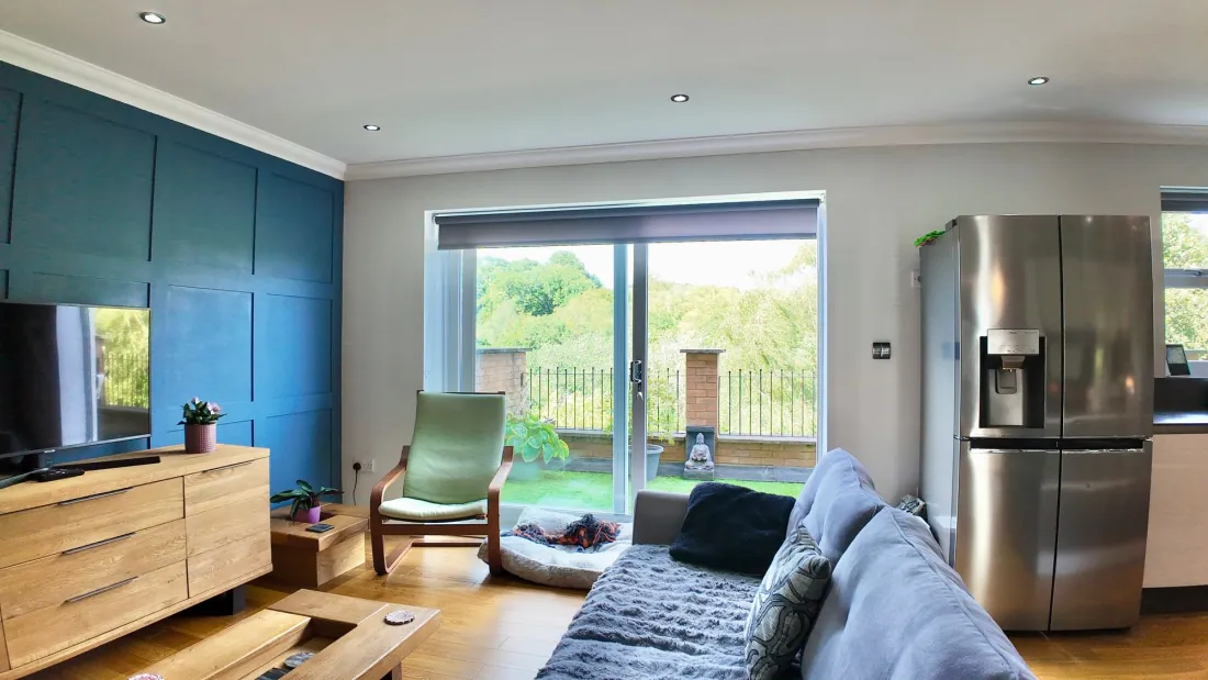 Sitting room with hearth and television