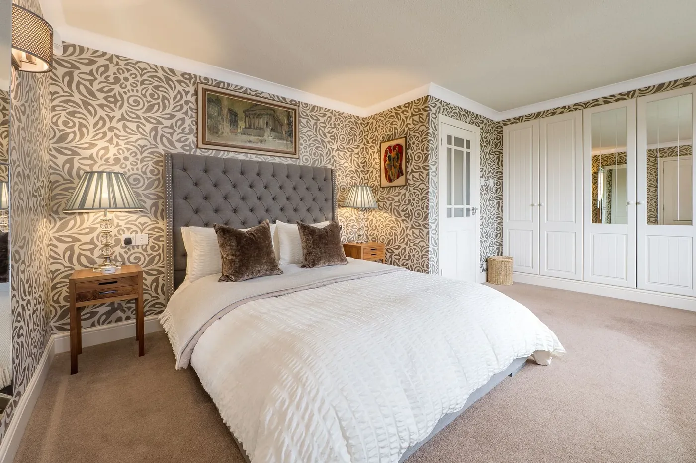 A bedroom with fitted wardrobes