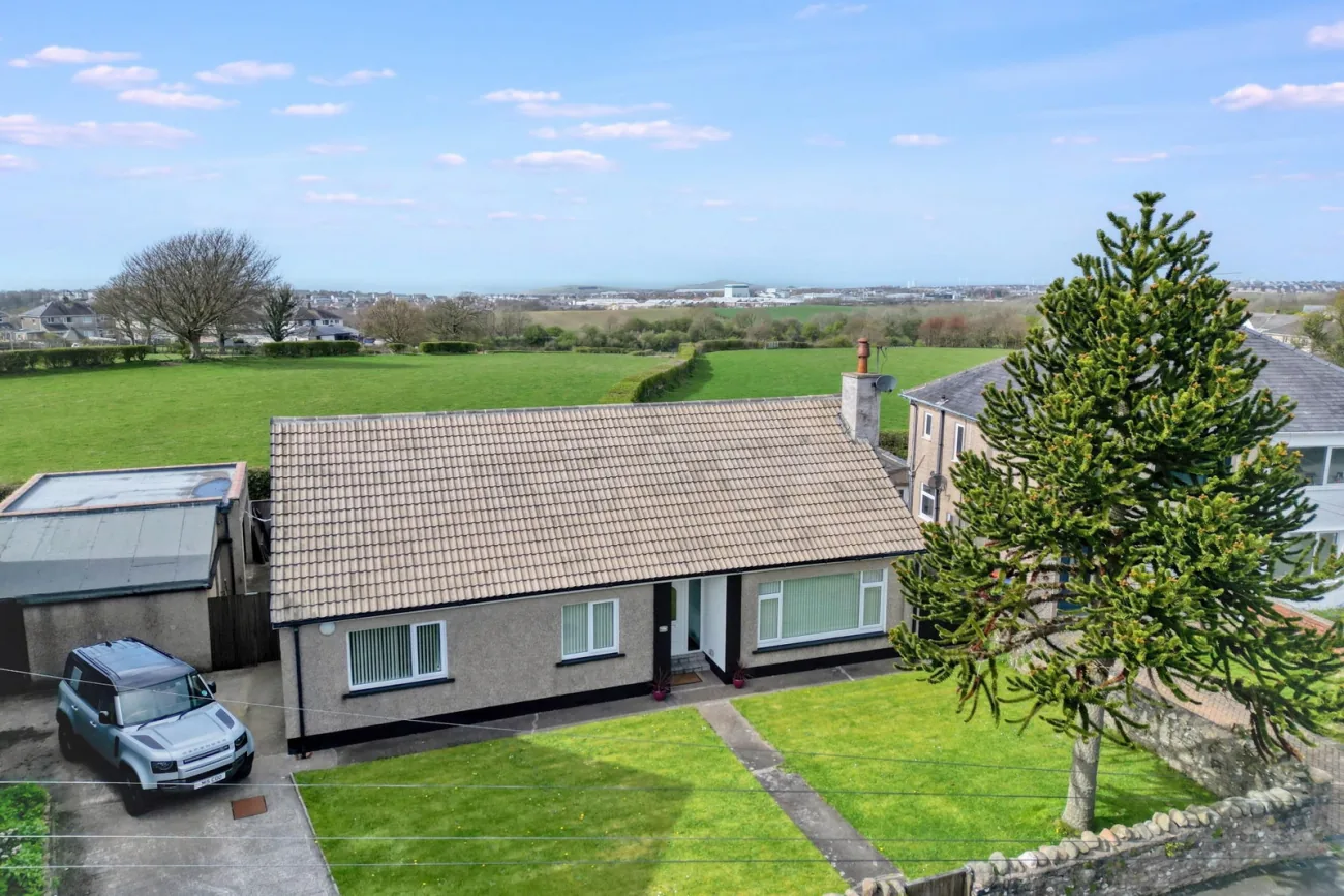 9A Scaw Road — the front elevation framed by the garden boundary wall