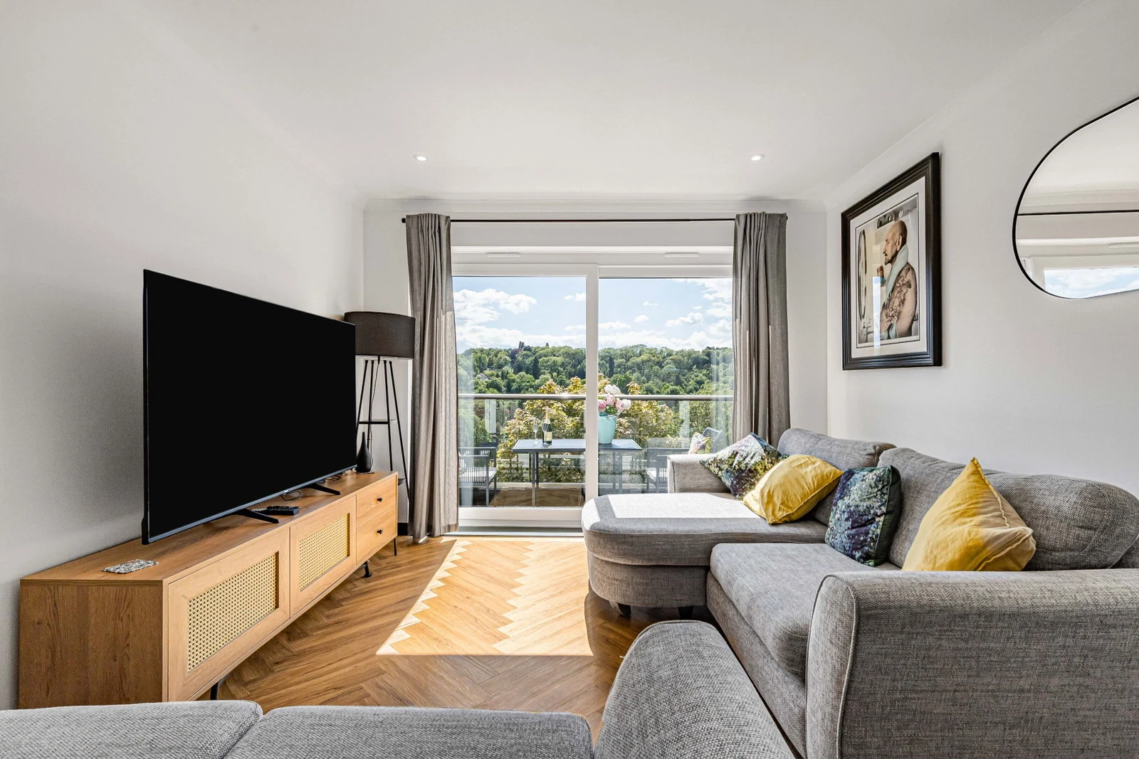 The open-plan living area looking through to the balcony.