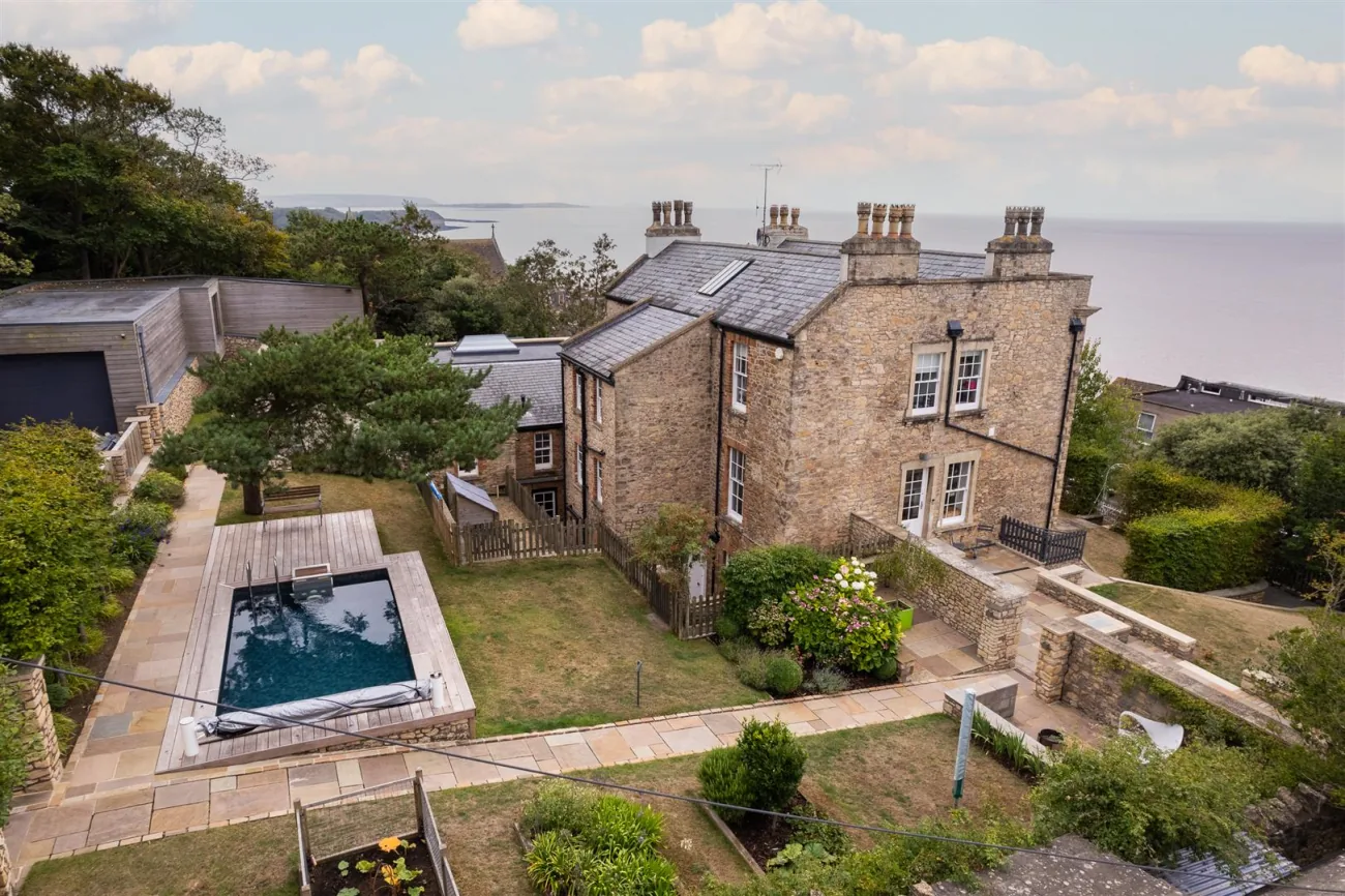 Stancliff seen from the air, with its terraced garden and heated pool above the Bristol Channel.