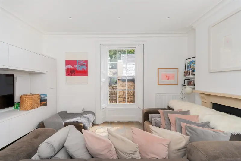 A third reception, with pink and grey furnishings.