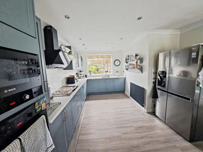 Open-plan kitchen with garden doors open