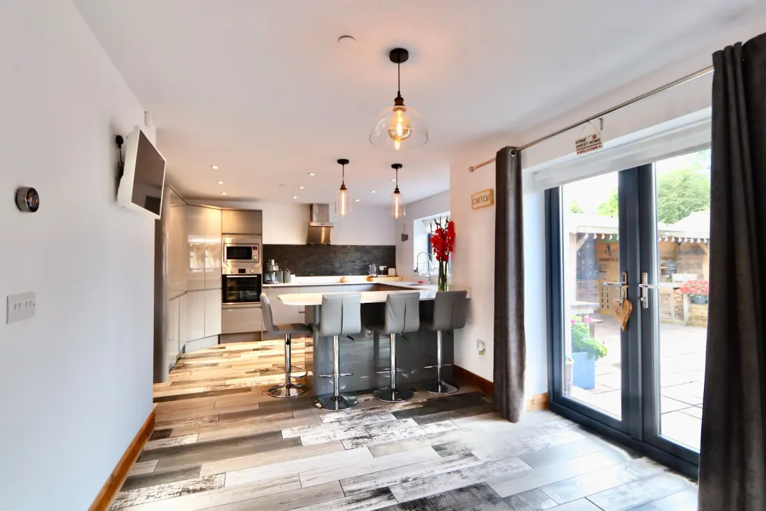 The open-plan kitchen and living room from the entrance.