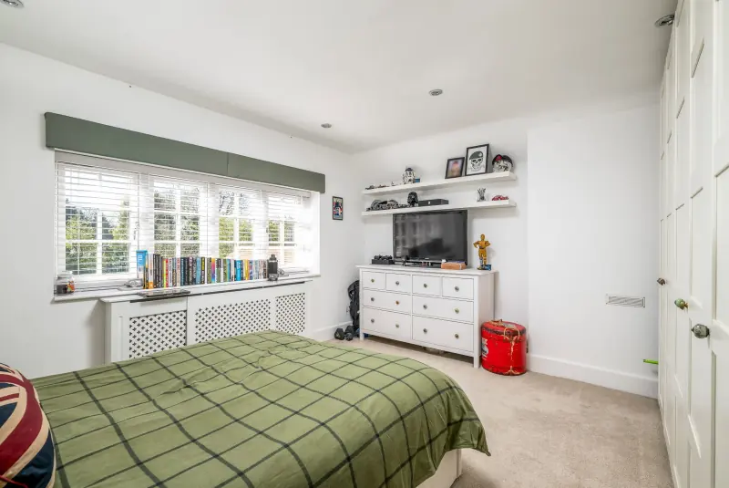Green-walled bedroom
