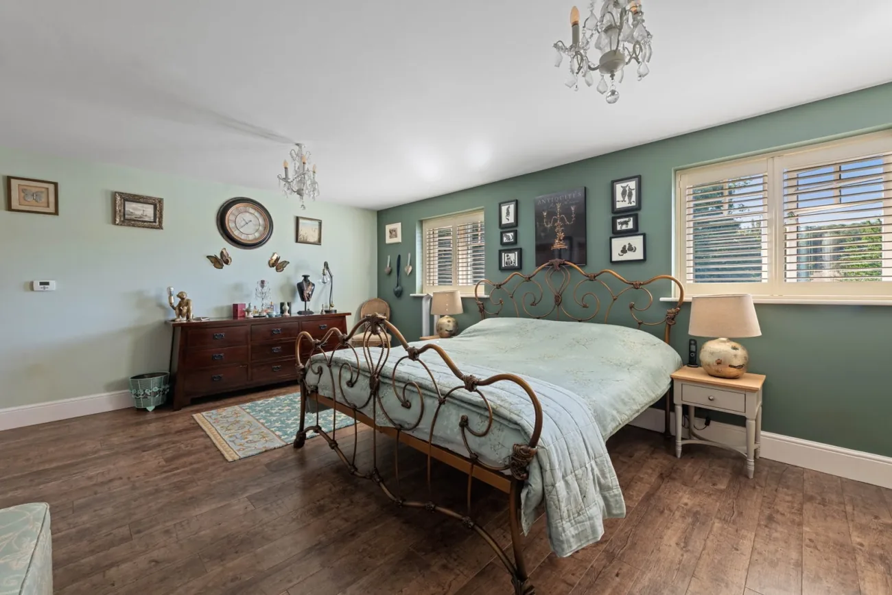 Bedroom two with plantation shutters.