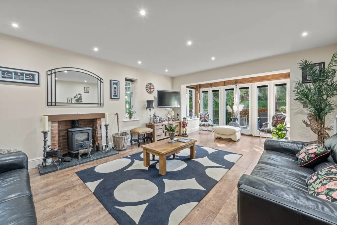 The lounge with stove and French doors.