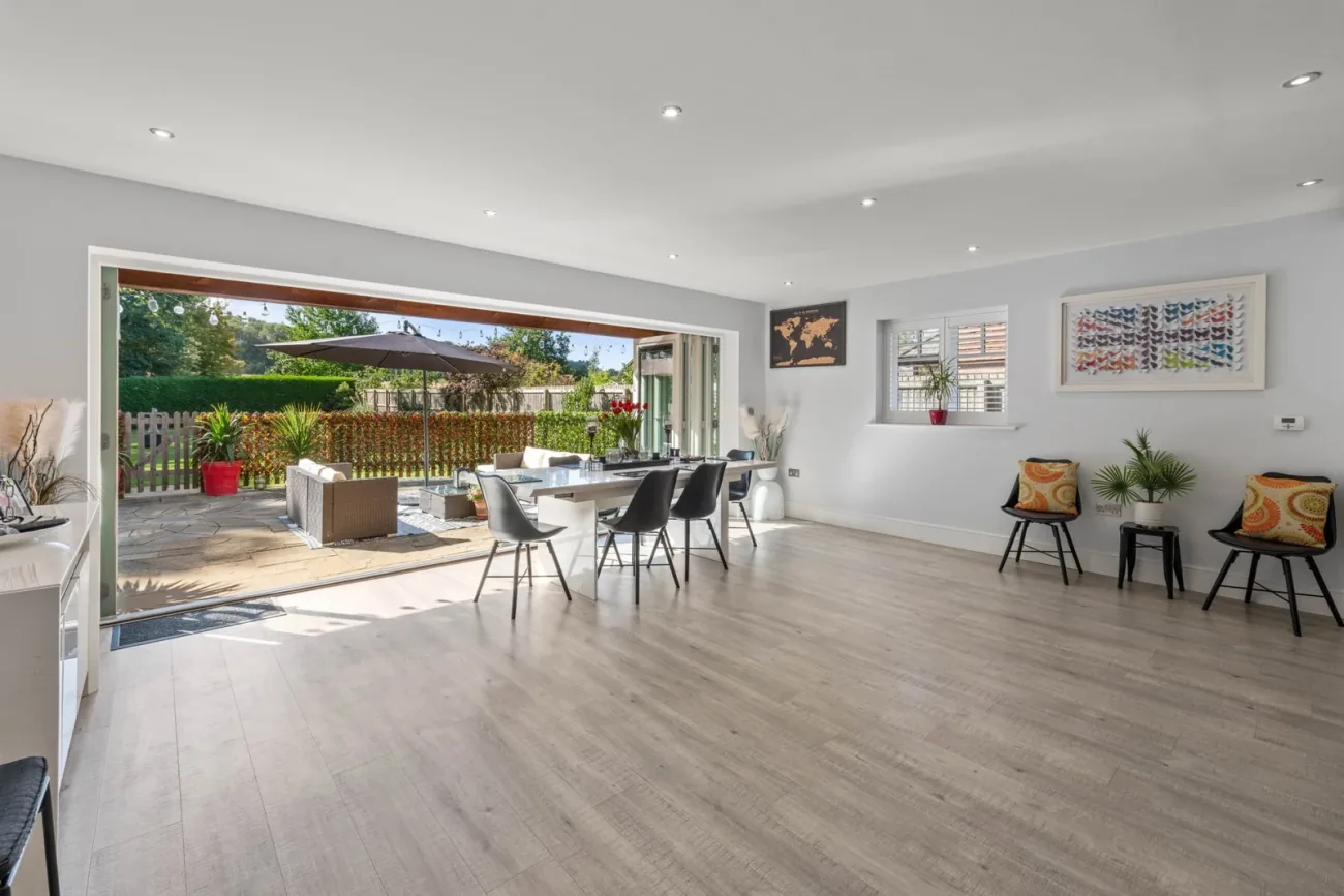 Open-plan kitchen with bi-fold doors to the sun terrace.