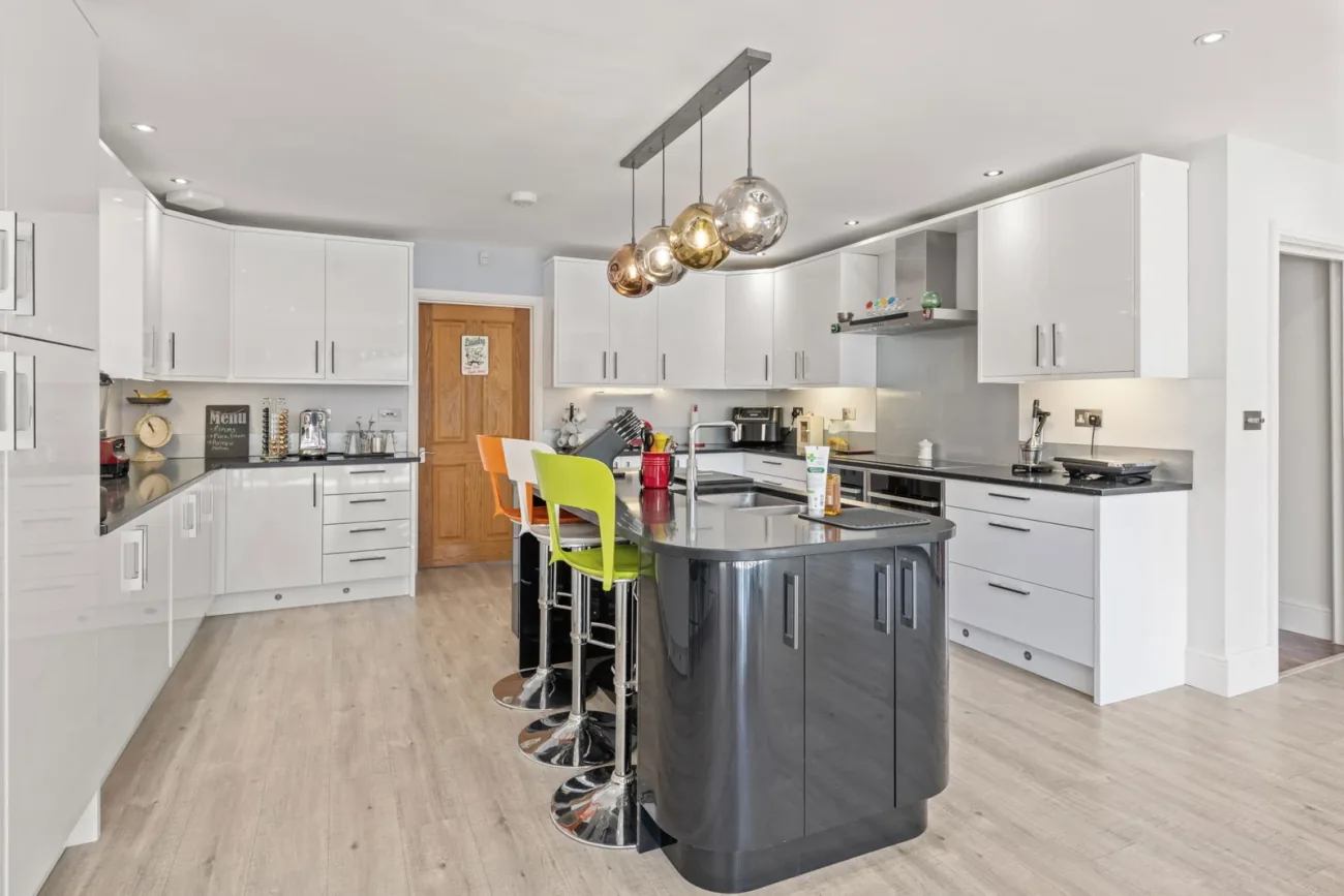Kitchen island with Neff and Siemens appliances.